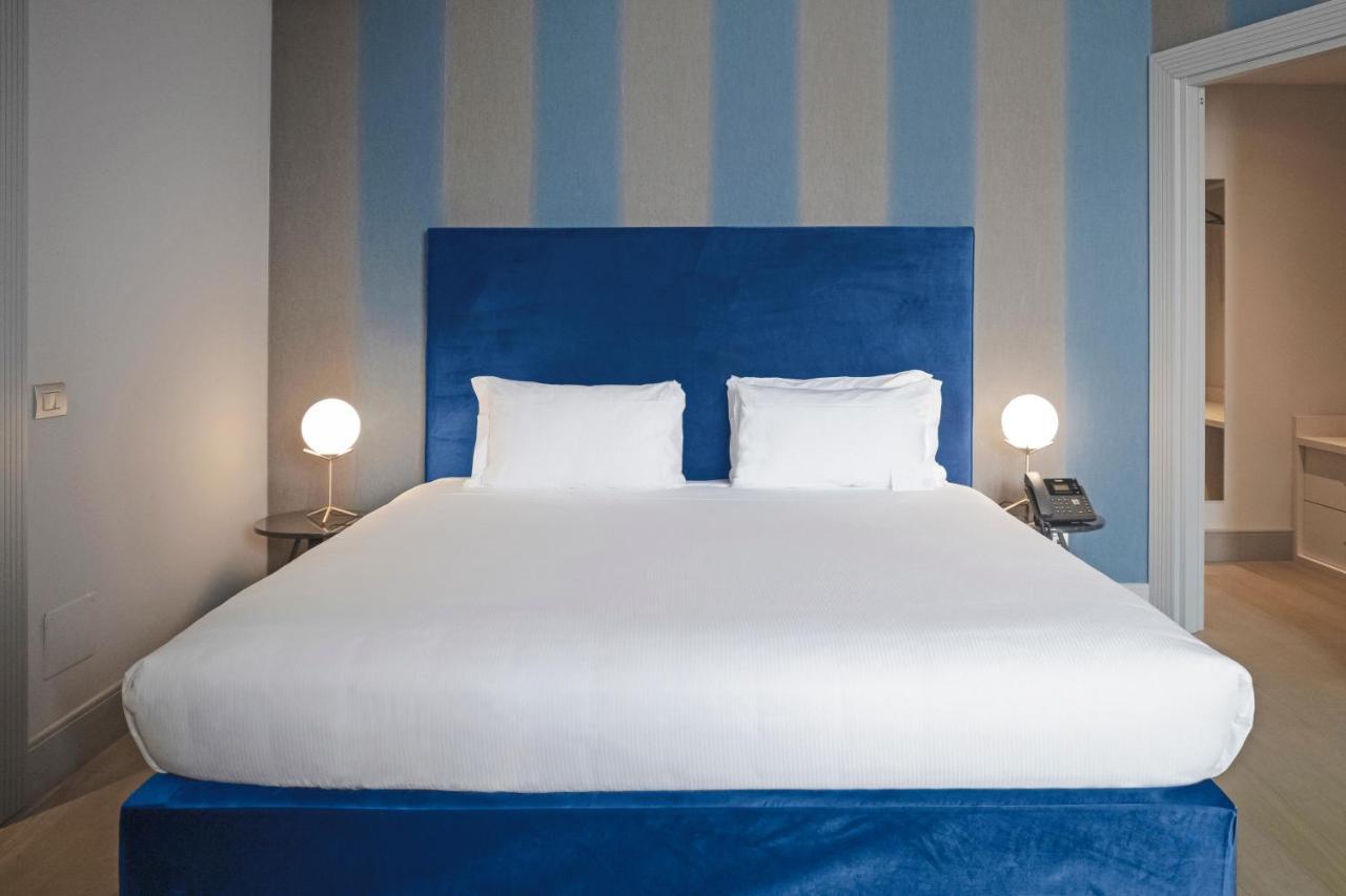 Palazzo Cornalia Hotel Milan Exterior photo A bedroom at the hotel