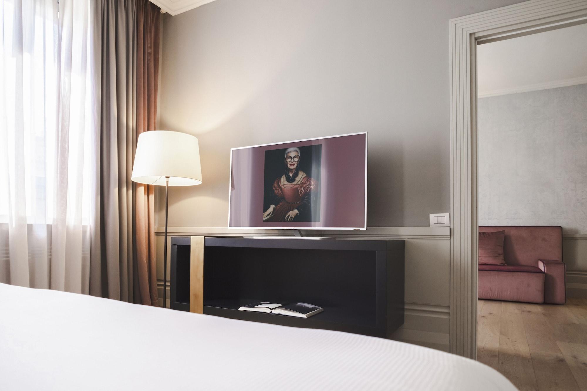 Palazzo Cornalia Hotel Milan Exterior photo A television in a hotel room