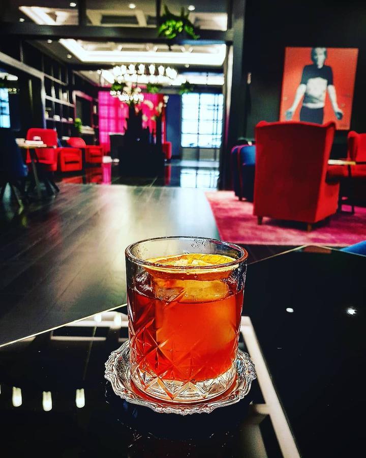 Palazzo Cornalia Hotel Milan Exterior photo A Negroni cocktail